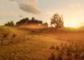 Dos jinetes cabalgan por una pradera al atardecer en Red Dead Redemption 2