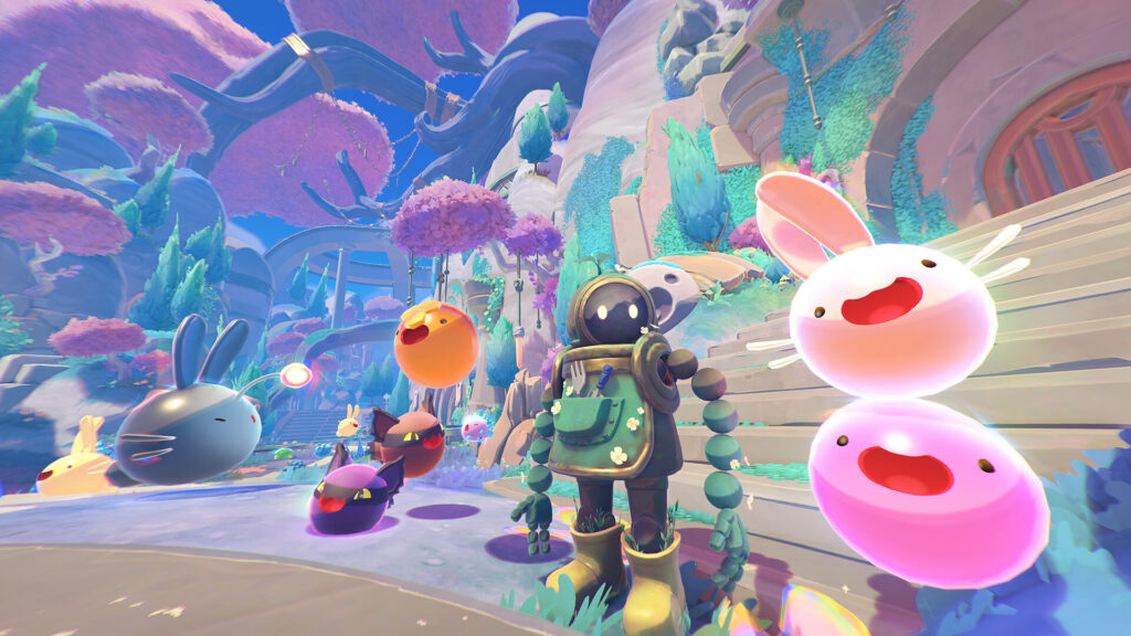 Beatrix LeBeau rodeada de slimes en Rainbow Island en Slime Rancher 2